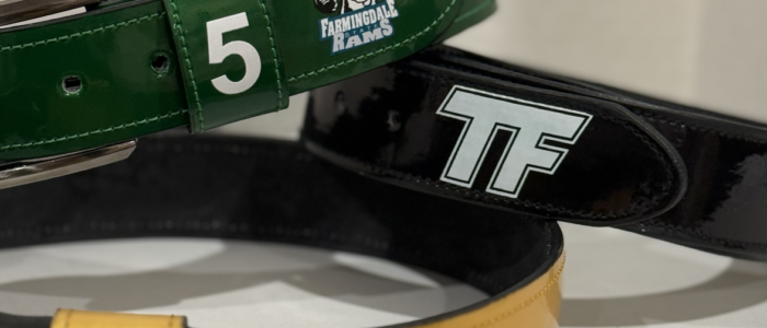 Custom baseball belts in green, black, and yellow